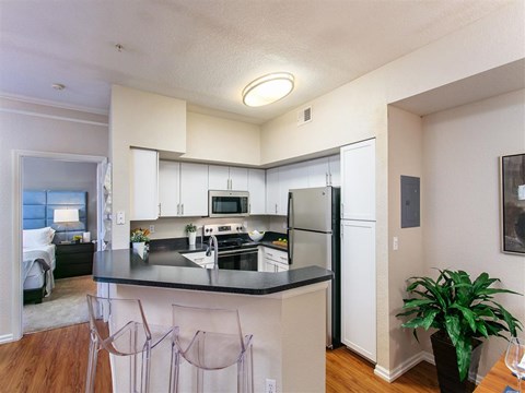 a kitchen with a counter top and a refrigerator