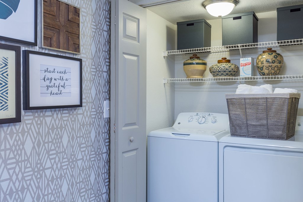 a laundry room with a washer and dryer