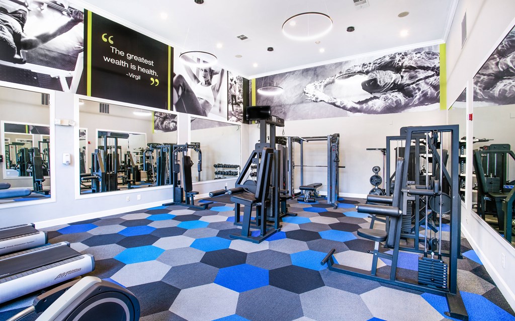 a gym with a black and white picture of a man on the wall