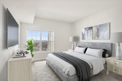 a bedroom with a bed and a window