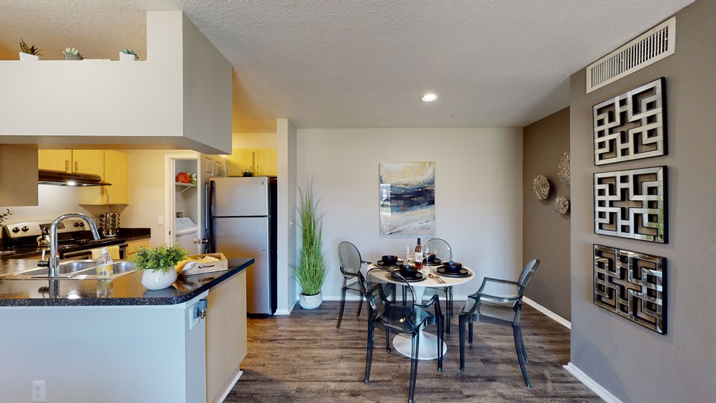 a kitchen and dining area in a 555 waverly unit