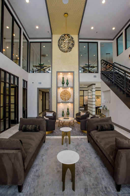 a large living room with couches and a table