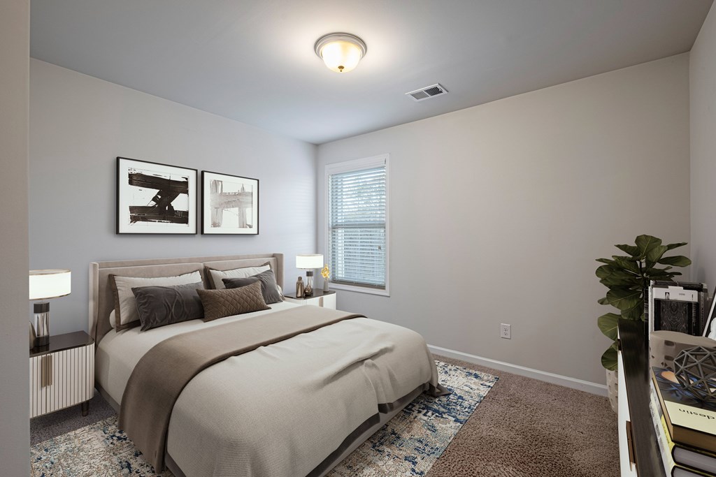 a bedroom with a large bed and a window