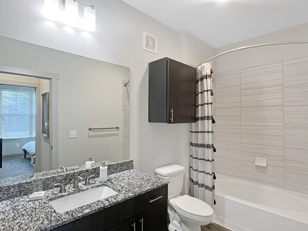 Spacious bath with garden tub and modern tiled shower
