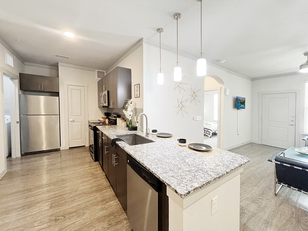 Large kitchen with an island and stainless steel appliances