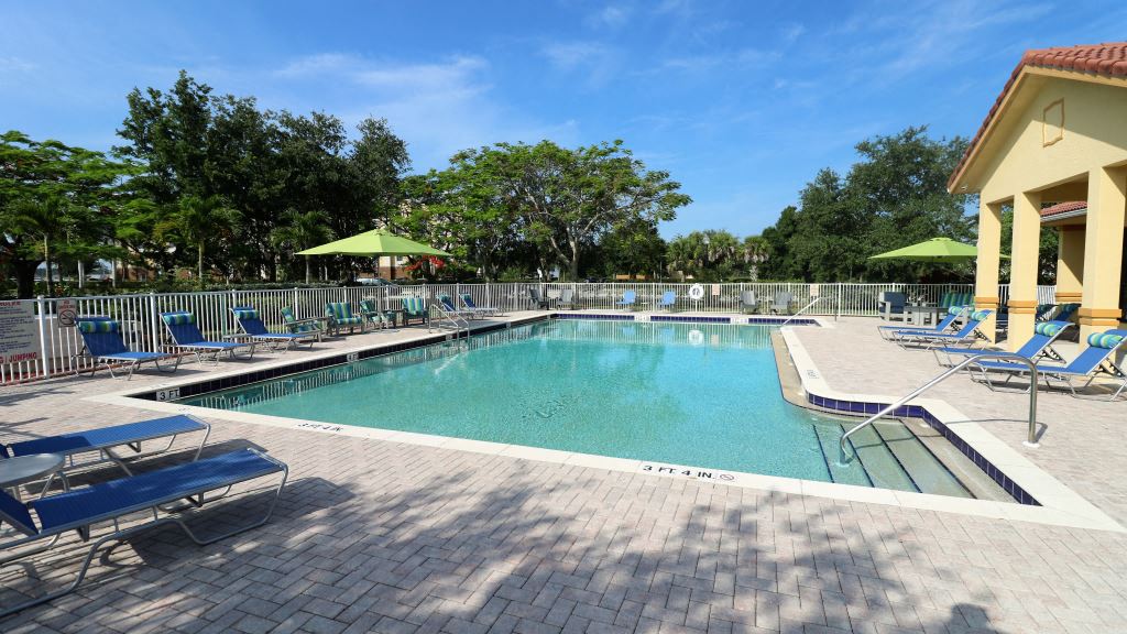 Pool area with lounge seatings and umbrellas