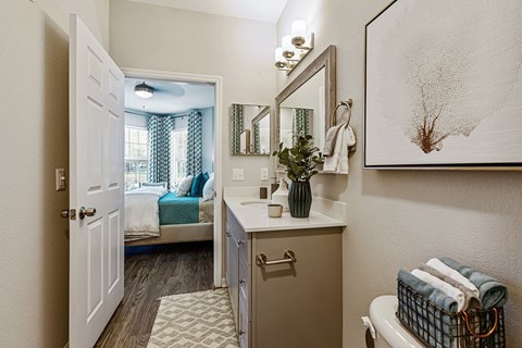 Bathroom With Quartz Countertops bathroom with a large mirror and ample lighting