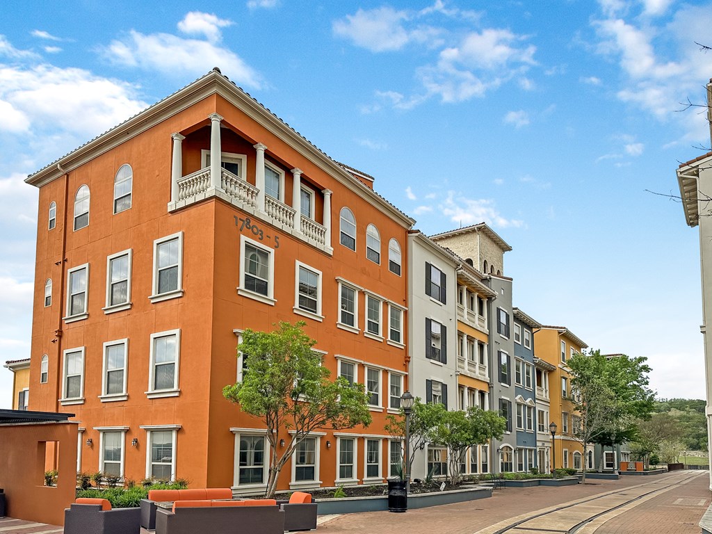a large orange building on a city street
