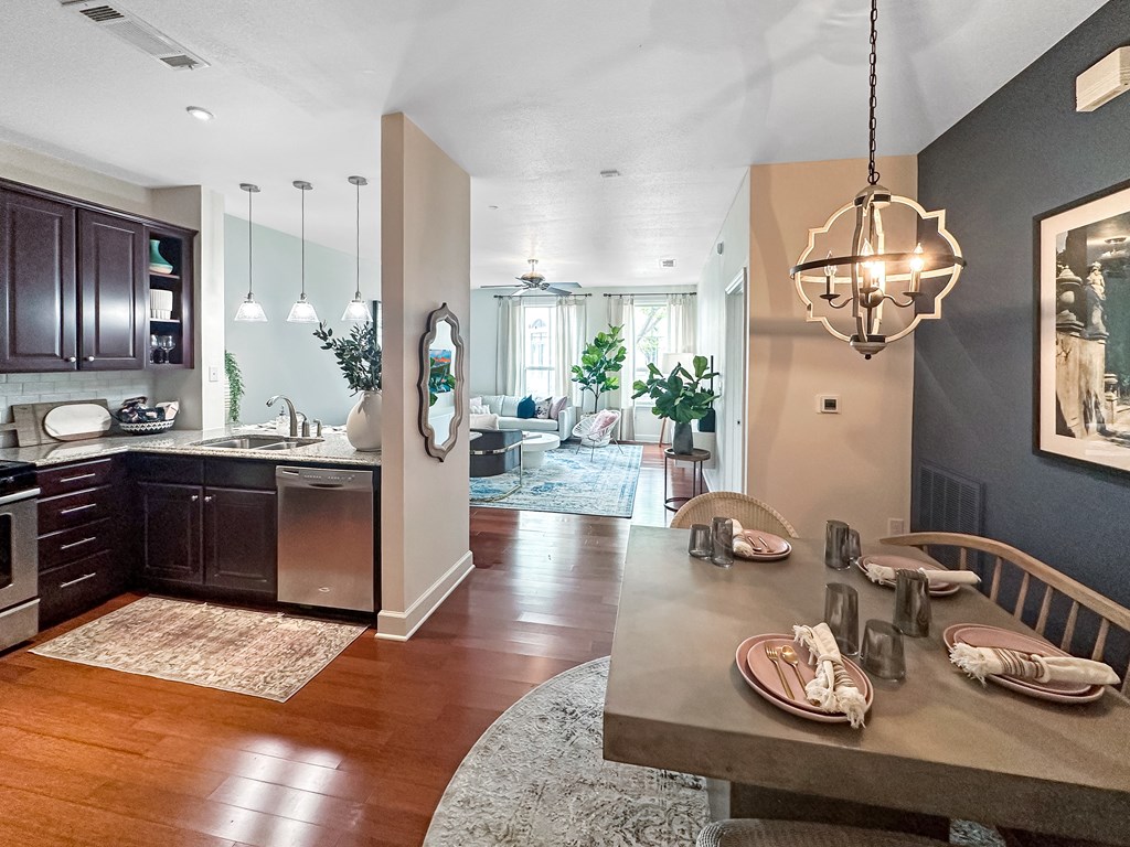 an open kitchen and dining room with a table and chairs
