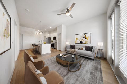A modern living room with a grey rug and brown chairs.