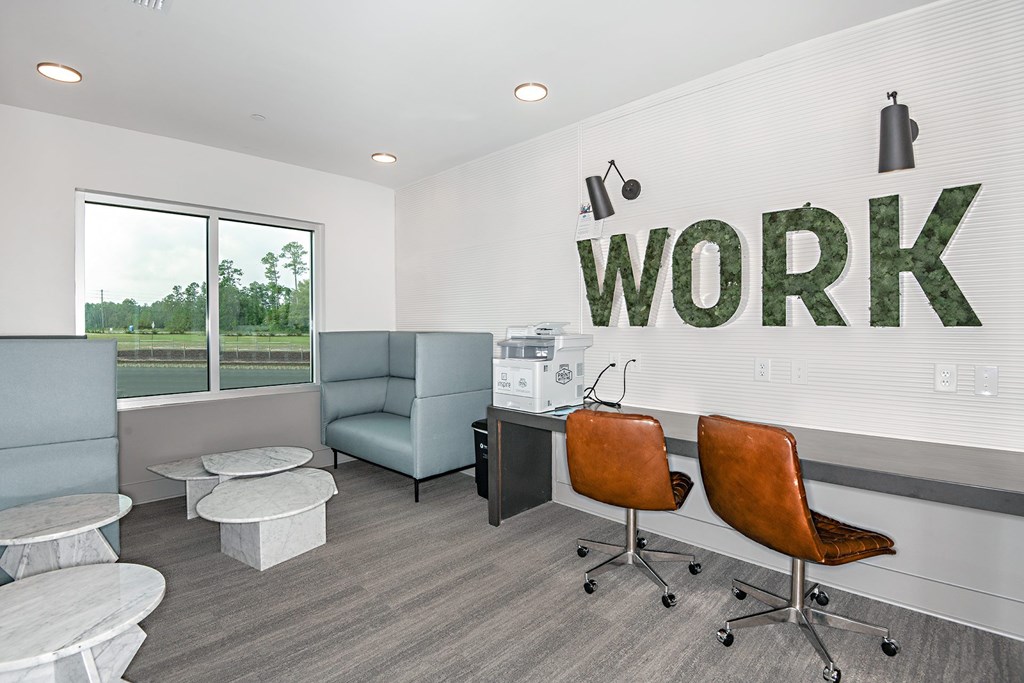 an office with a work sign on the wall