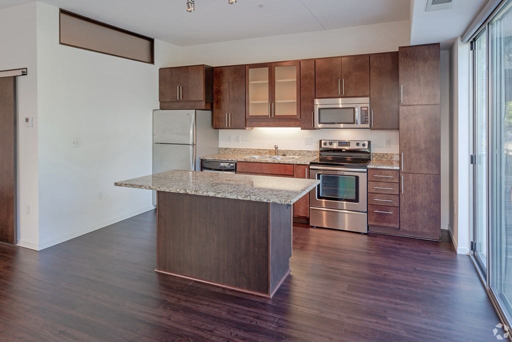 1800 Lake Kitchen with island, cherry cabinetry and stainless steel appliances