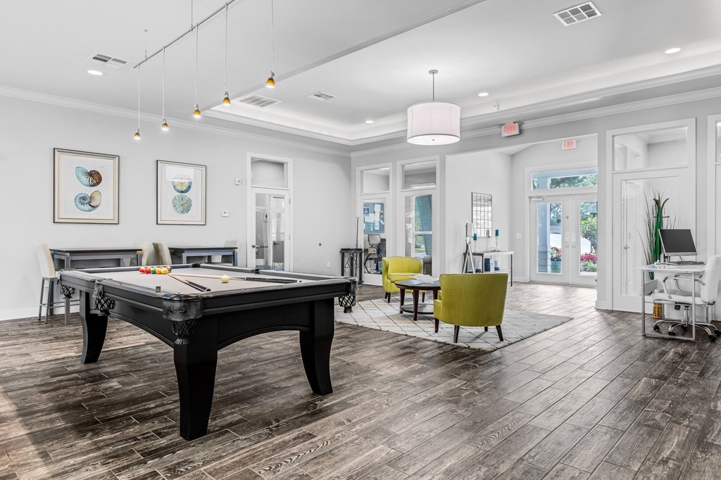 Resident Clubhouse Interior with Pool Table and Lounge Area