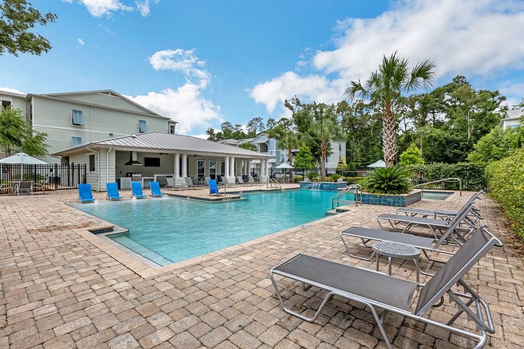 Beautiful Resort Style Pool Surrounded by Palm Trees