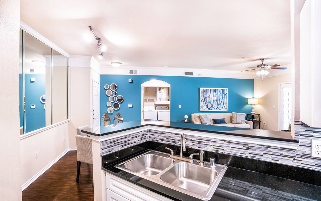 a kitchen with a sink and a counter top