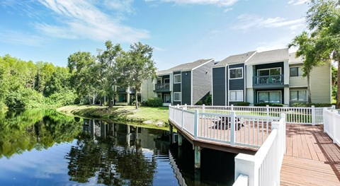 A row of houses are built over a body of water.