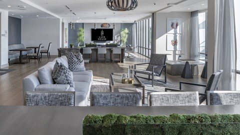 A living room with a grey couch and a television.