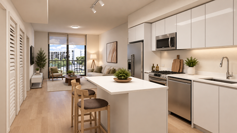 A modern kitchen with white cabinets and a large island.