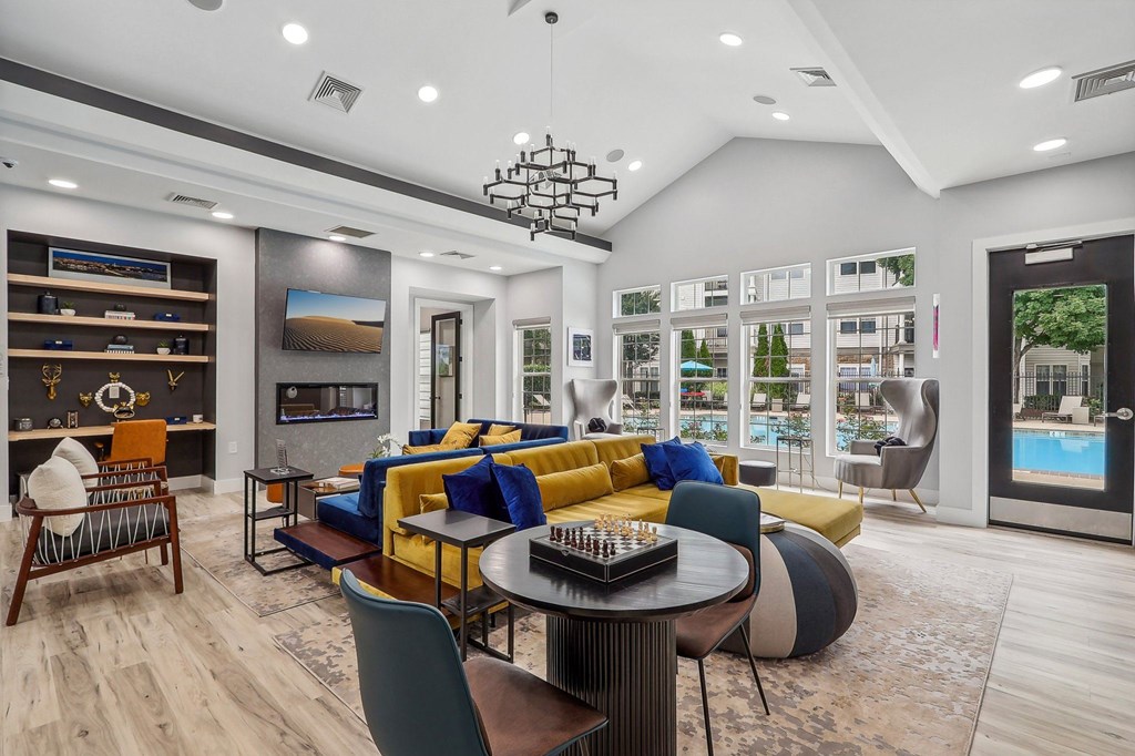 resident clubhouse with seating and kitchen