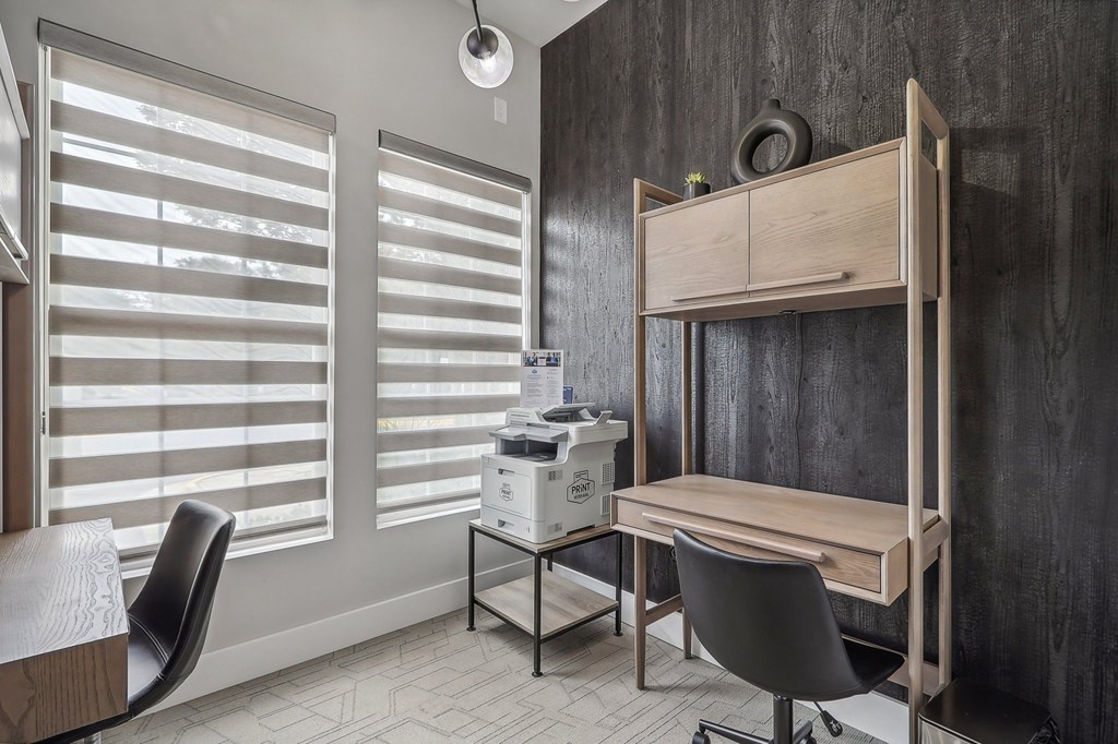 business center with two desks and chairs