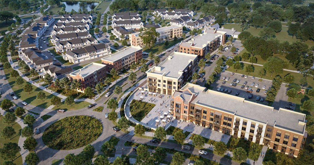 A large building complex with a circular driveway in front.