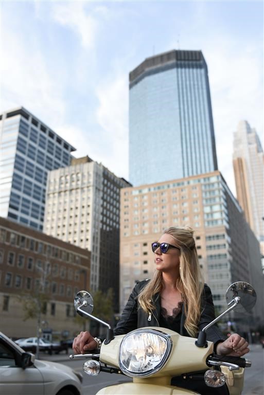 Girl on moped in downtown minneapolis