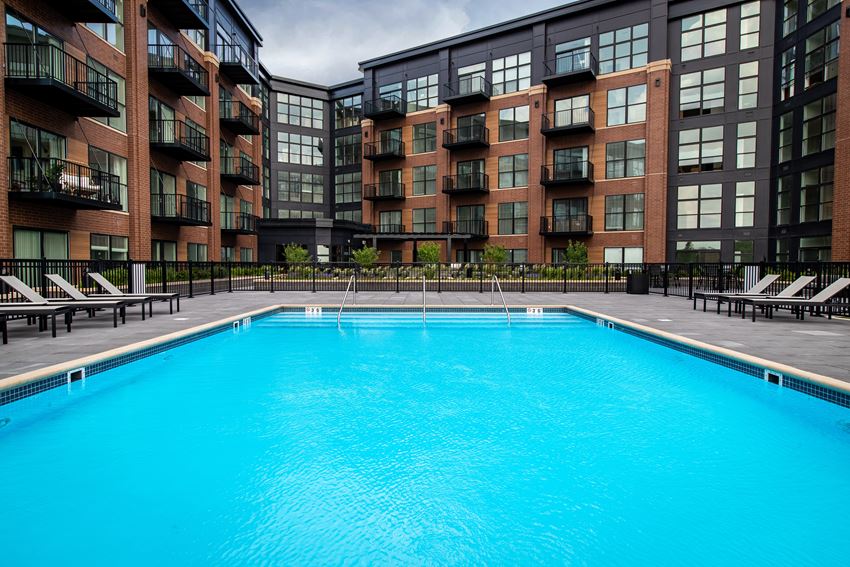 a swimming pool in front of a building