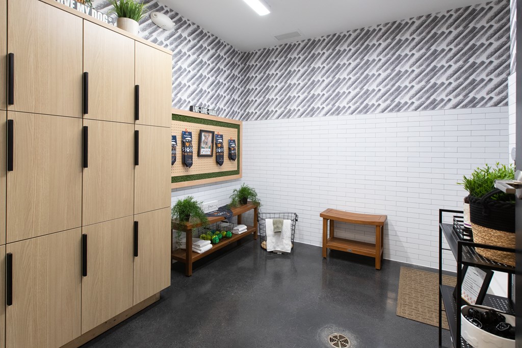 a room with a metal ceiling and a wooden cabinet with plants on top of it