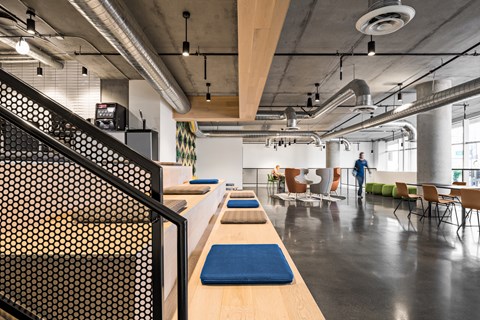 A room with a long table and chairs.