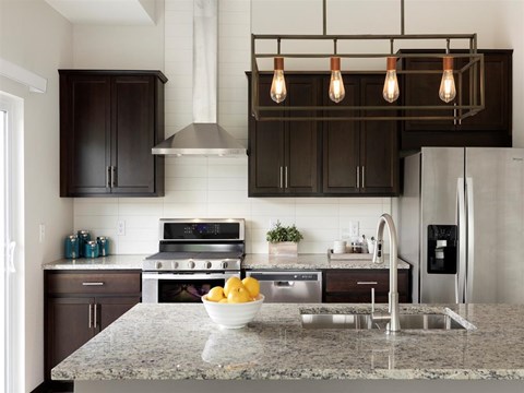a kitchen with a granite counter top and a sink