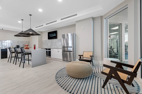 A modern kitchen with a dining table and chairs.