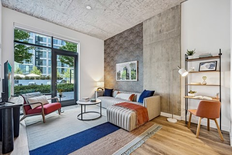 a living room with a couch and a large window