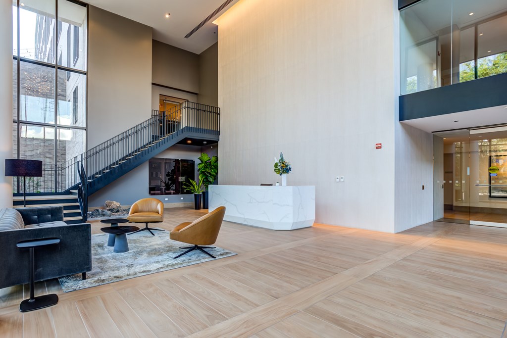 Modern Style Lobby with Plank Flooring and Staircase at North+Vine Apartments in Illinois, 60610