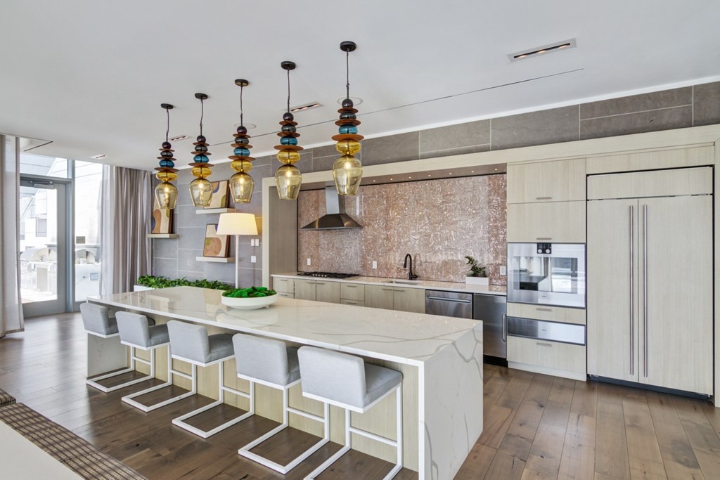 Full kitchen for resident use with all major appliances and island with bar seating