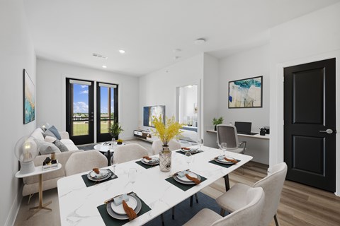 A modern dining room with a white marble table and chairs.