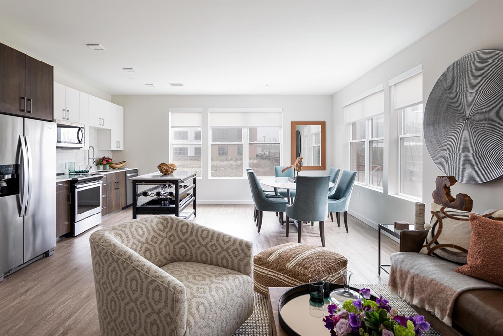 a living room with a kitchen and a dining room