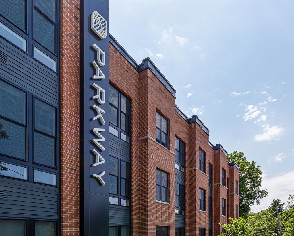 a large brick building with a sign on the side of it