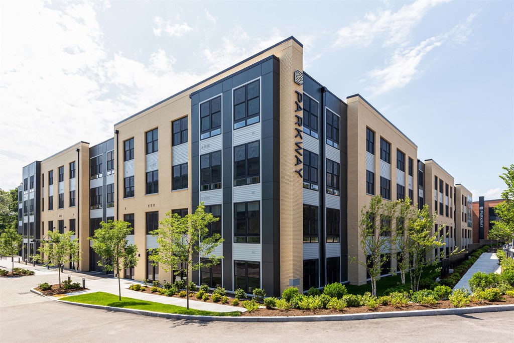 a large building with trees in front of it
