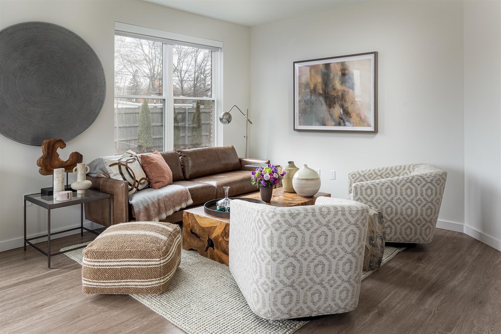 a living room filled with furniture and a window