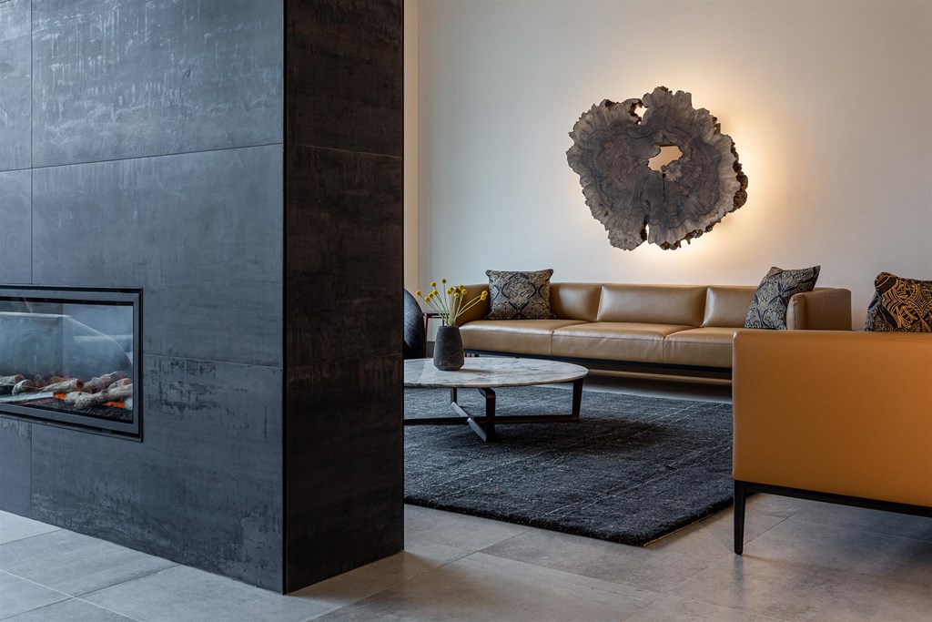 a living room with a couch and a fireplace