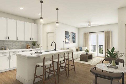 A modern kitchen with white cabinets and a large island.