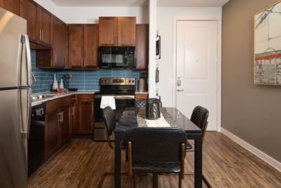Parkside at Round Rock Kitchen and Dining Area with Built in Cabinets and Backsplash