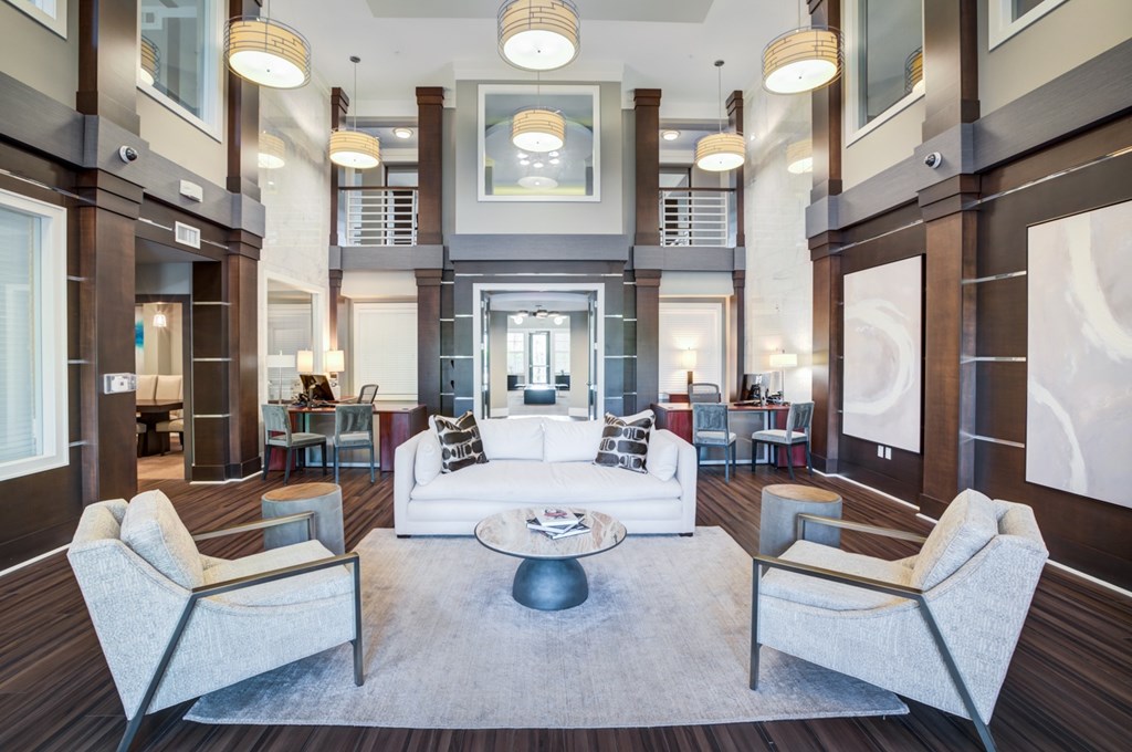 a living room filled with furniture and a large window