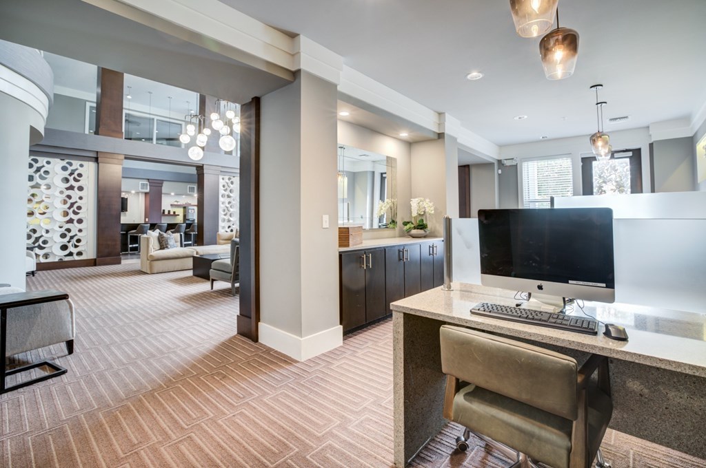 a computer desk with a keyboard and mouse on top of it