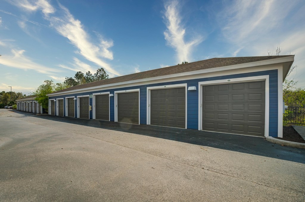 a row of garages with one garage door open