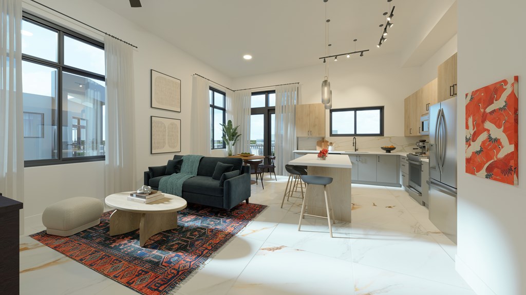 a living room and kitchen in an open floor plan