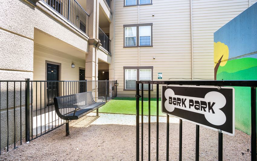 a bench in front of a building with a sign that reads berks park