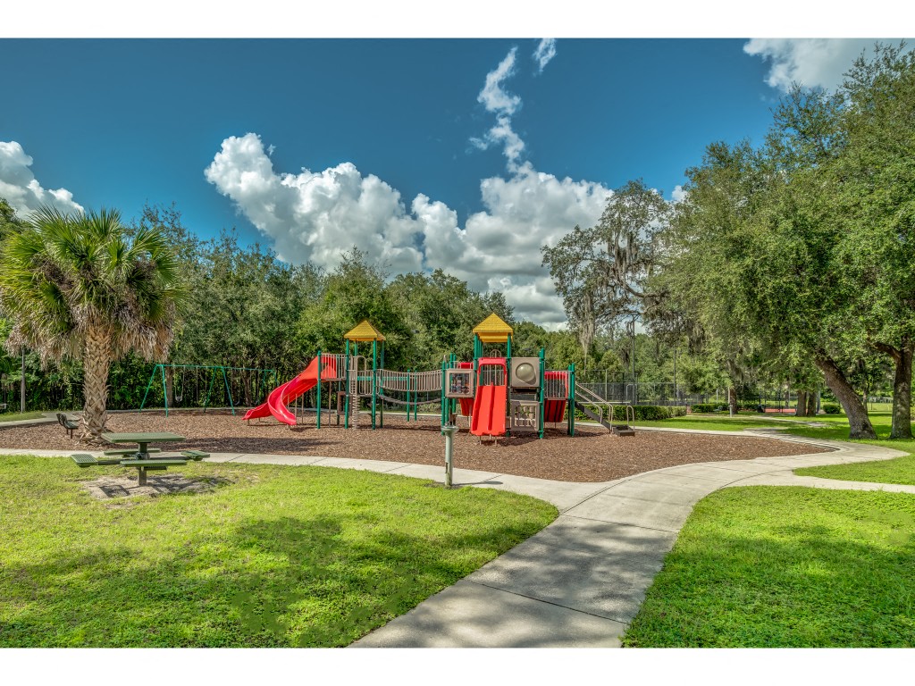 an image of a playground in a park with trees