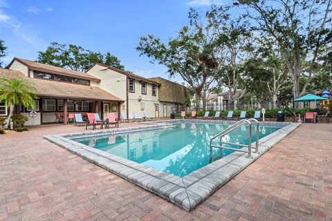 A rectangular pool with a metal railing around it.