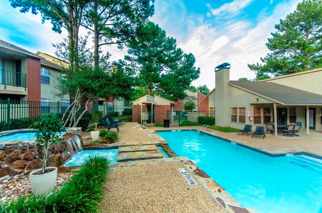 Exterior View of Property Featuring Sparkling Swimming Pool with Heated Jacuzzi and Beautiful Fountains